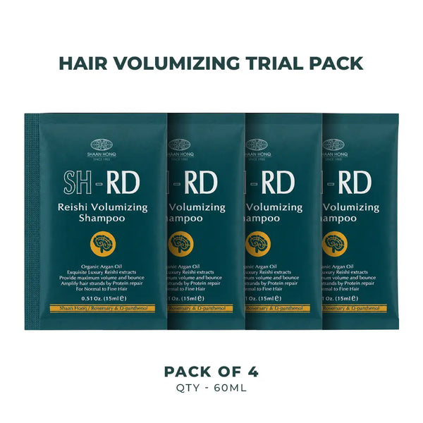 Four dark teal shampoo sachets labeled SH-RD Reishi Volumizing Shampoo arranged in a row on a white background, with the text 'HAIR VOLUMIZING TRIAL PACK' above and 'PACK OF 4 QTY - 60ML' below.