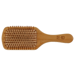 A wooden hairbrush with brown bristles, featuring the brand name 'SH-RD' engraved on the handle, set against a plain white background.
