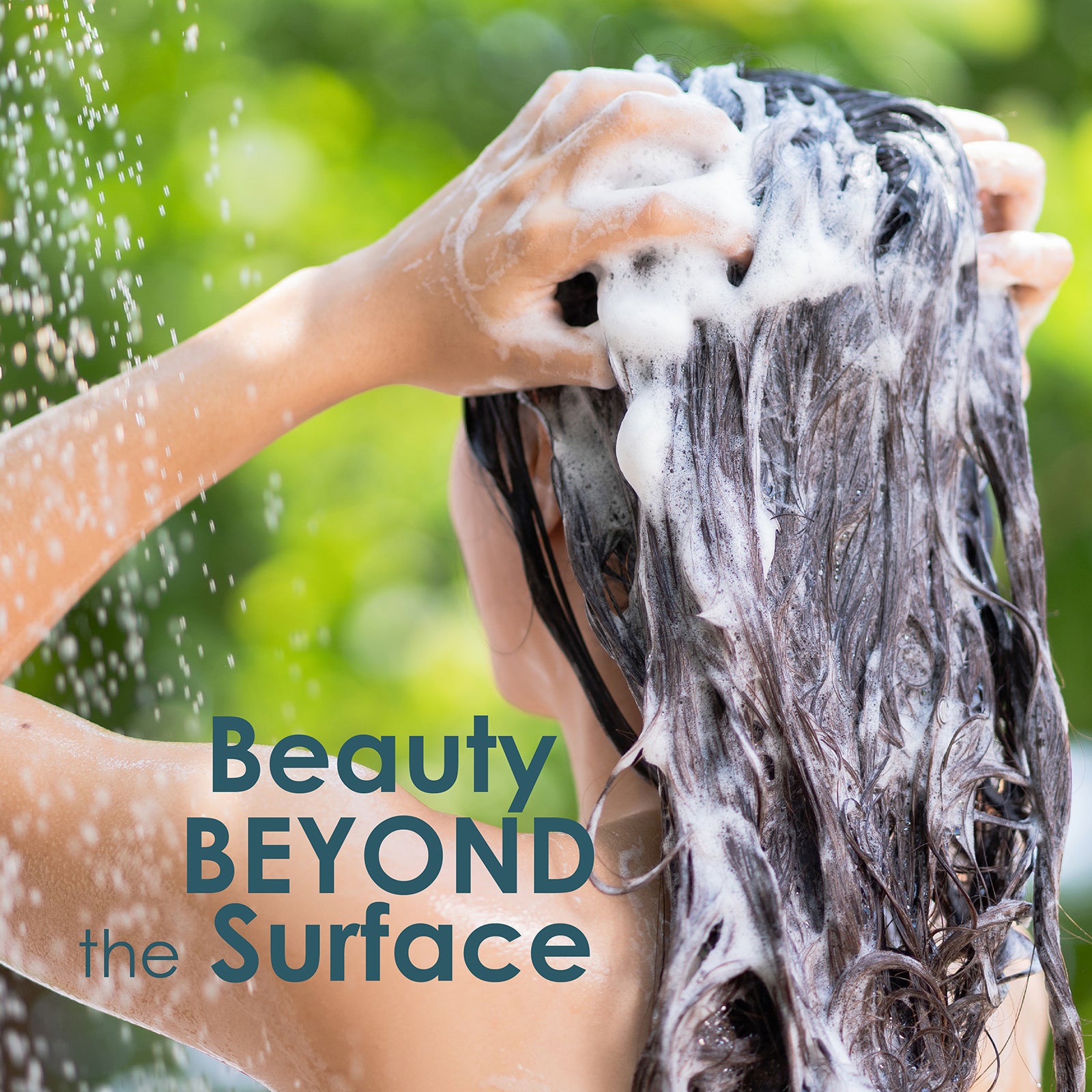 A person washing their hair with foamy shampoo outdoors, with green foliage in the background and the text 'Beauty BEYOND the Surface' overlaid on the image.