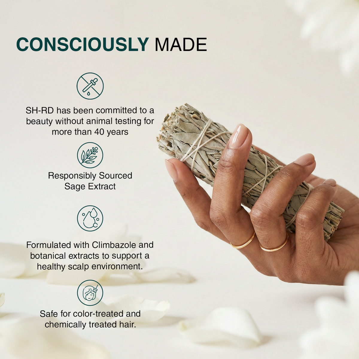 A hand holds a bundle of dried sage leaves against a soft, light beige background with decorative petals. Text on the left reads 'CONSCIOUSLY MADE' with bullet points about SH-RD animal testing, responsibly sourced sage extract, and safety for color-treated and chemically treated hair.