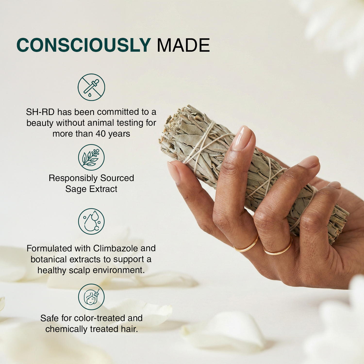 A hand holds a bundle of dried sage leaves against a soft, light beige background with decorative petals. Text on the left reads 'CONSCIOUSLY MADE' with bullet points about SH-RD animal testing, responsibly sourced sage extract, and safety for color-treated and chemically treated hair.