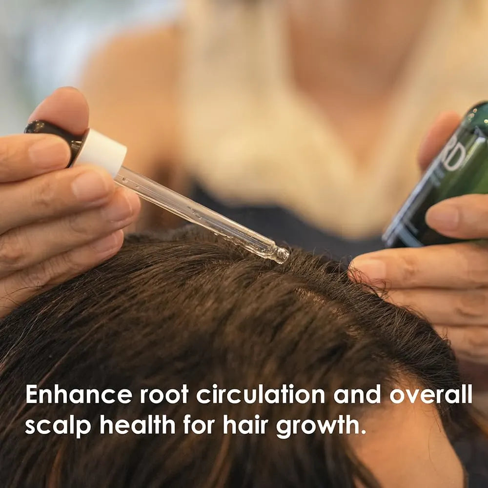 Person applying a hair growth product to their scalp with text about enhancing root circulation and scalp health.