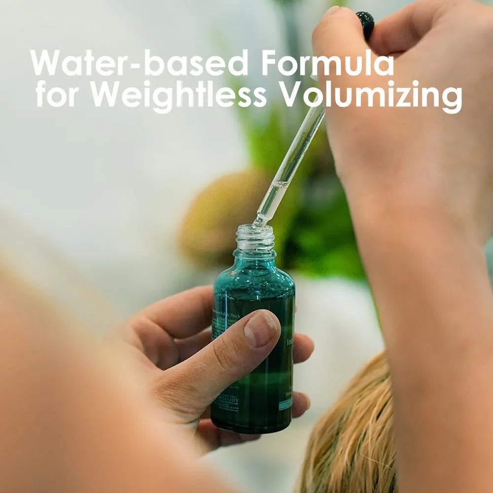 Hand holding a dropper bottle with a water-based formula for weightless volumizing text overlay.