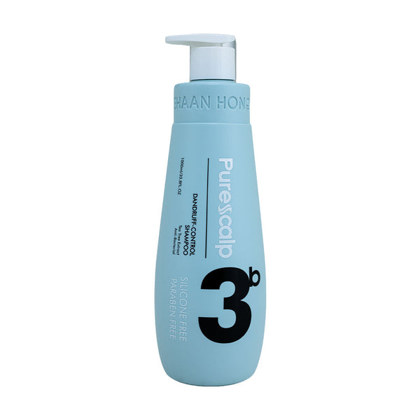 A light blue bottle of 3b Purescalp Dandruff Control Shampoo with a white pump dispenser, shown on a solid white background.