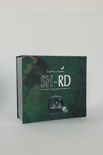 A boxed hair care product labeled 'SH-RD' with the tagline 'Light as a feather' and 'Scalp & Hair Care' on the front, photographed on a plain light gray background.