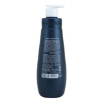 A dark navy blue bottle of Shaaan Honk Herbal Calming Massage cream with a white pump dispenser, shown from the back on a white background.