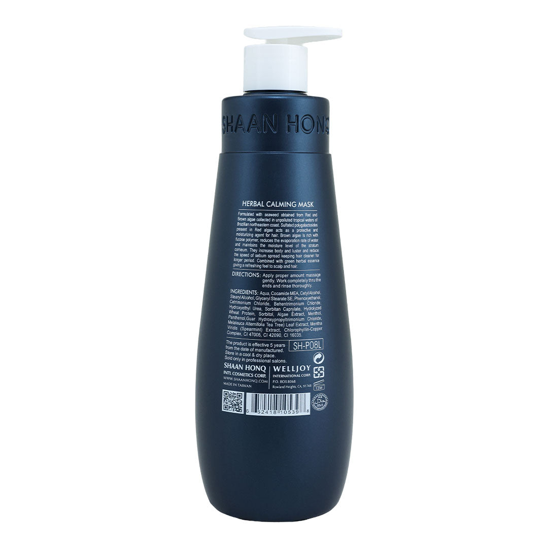 A dark navy blue bottle of Shaaan Honk Herbal Calming Massage cream with a white pump dispenser, shown from the back on a white background.