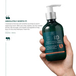 Hand holding a bottle of SH-RD Red-Ginseng Hair-Activating Shampoo with customer review text.