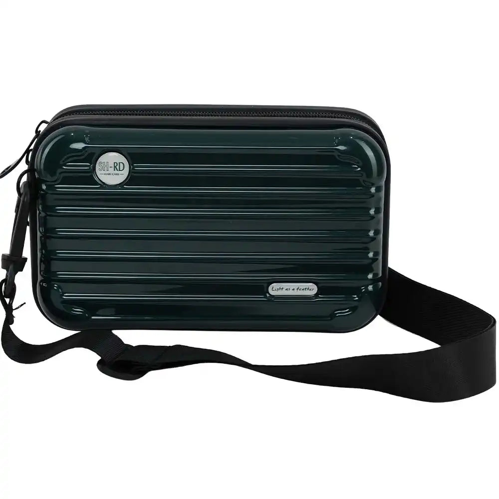 A dark green ribbed hard-shell crossbody bag with a black strap, featuring a circular 'Hi-RD' badge and a small silver 'Crafted in a Studio' plaque on a white background.